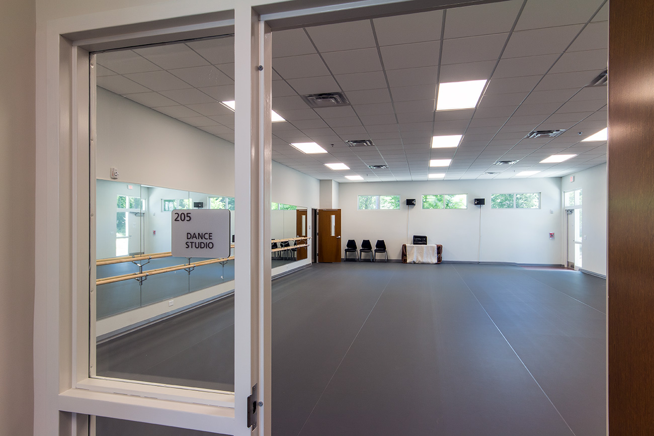 A large and mirror-lined dance studio in the Leland Cultural Arts Center